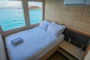 Wide interior view of the Lamalera private cabin aboard Mosalaki