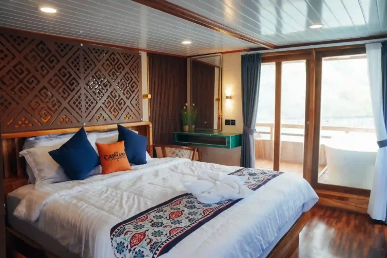 Master cabin on the upper deck of Carnaby 02 with a double bed and ocean view