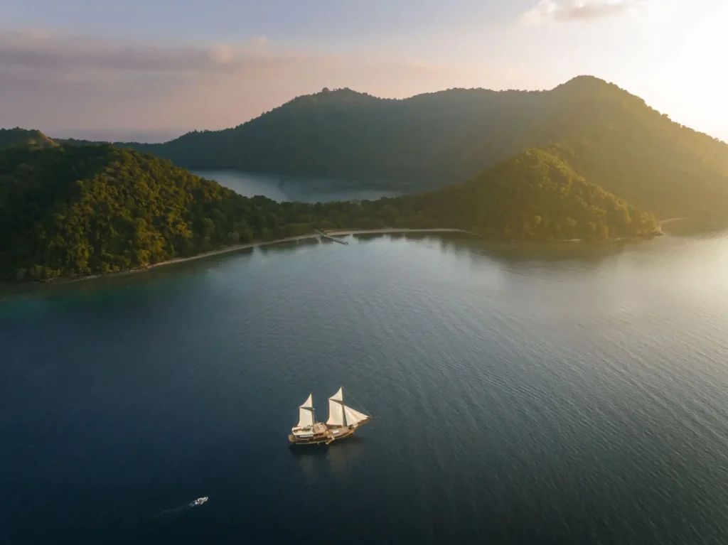 The Celestia phinisi yacht anchored off Satonda Island in Indonesia