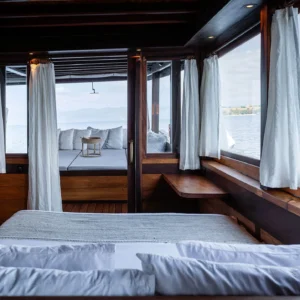 Master cabin with direct access to the bathing platform aboard Dewata