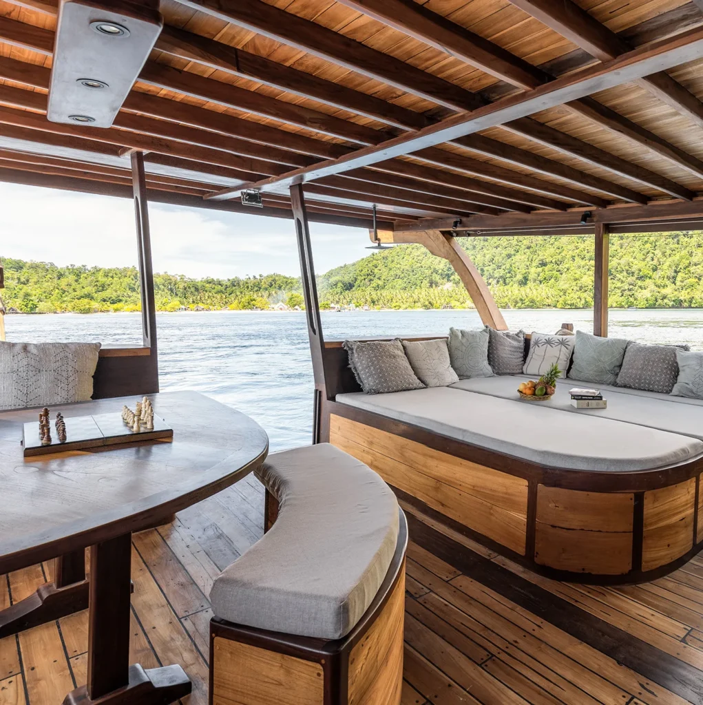 Private terrace with sunbed and alfresco shower aboard Dewata