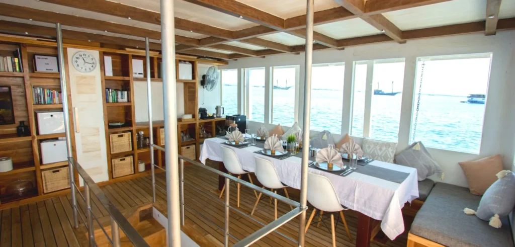 Indoor saloon and dining area aboard Fenides liveaboard