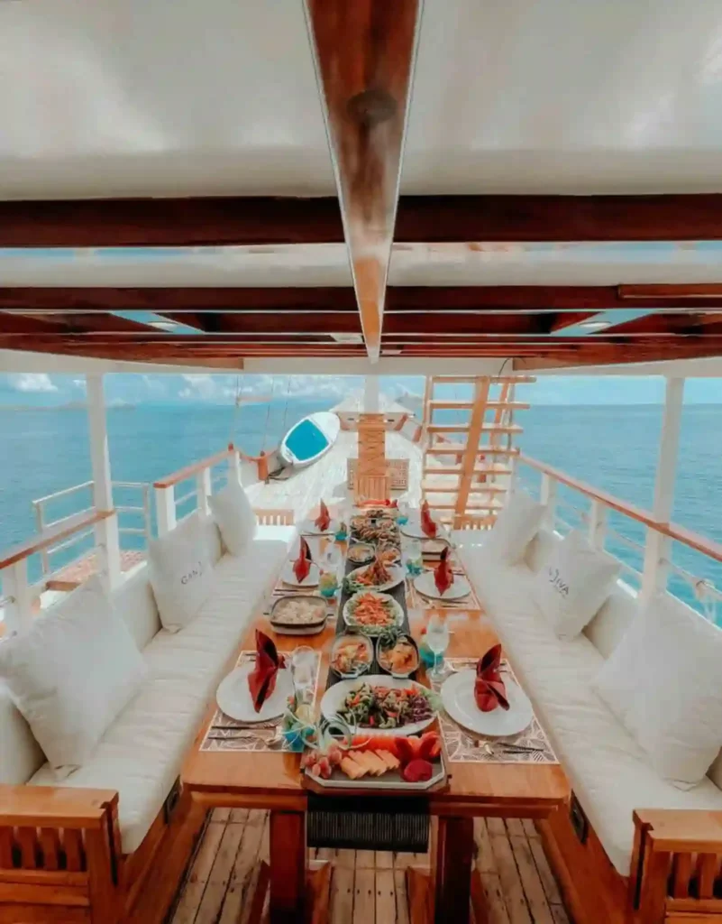Outdoor dining table aboard Gandiva Phinisi