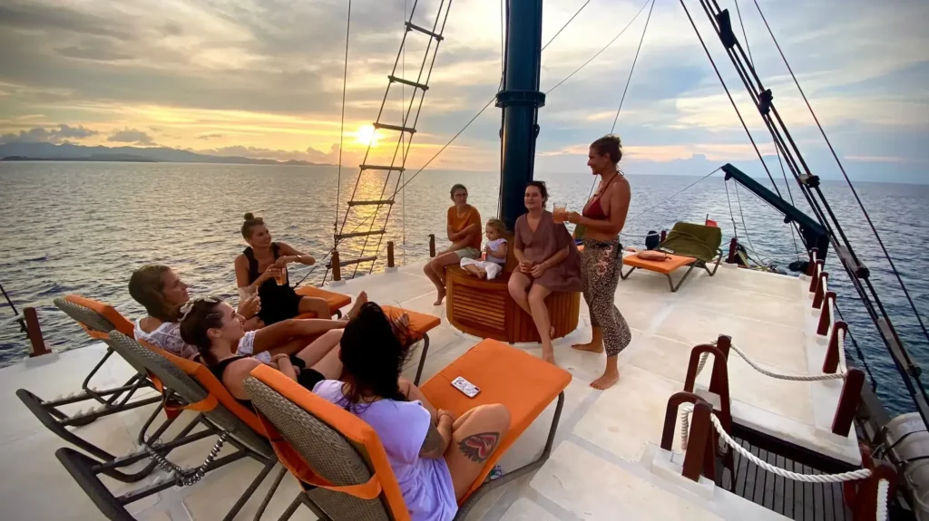 Guests relaxing in the outdoor lounge aboard Iliké