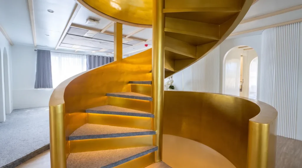 Gold spiral staircase aboard LASHA