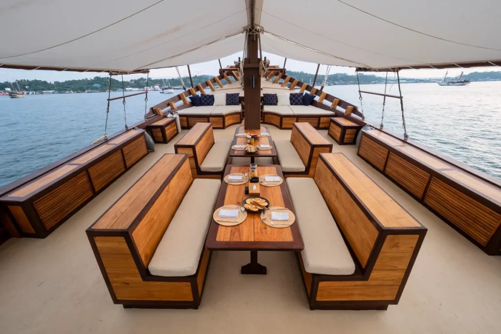 Forward outdoor dining area aboard Majik