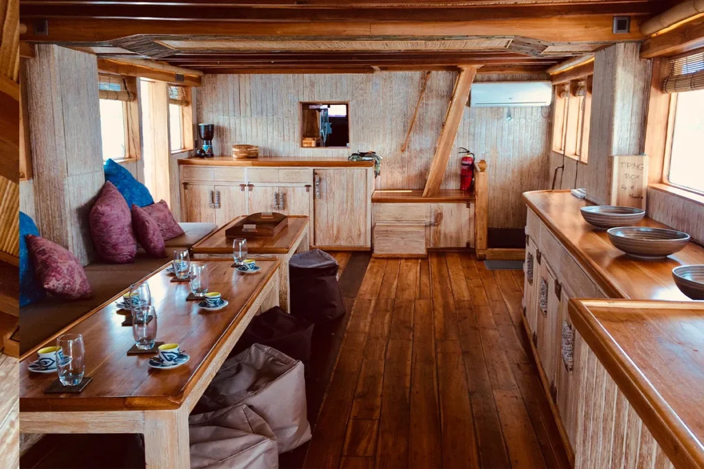 Indoor saloon and dining room aboard Mikumba Dua