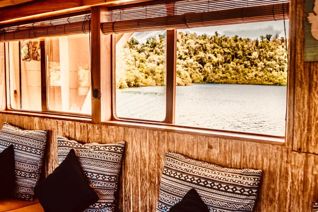 Window-side lounge aboard Mikumba Dua