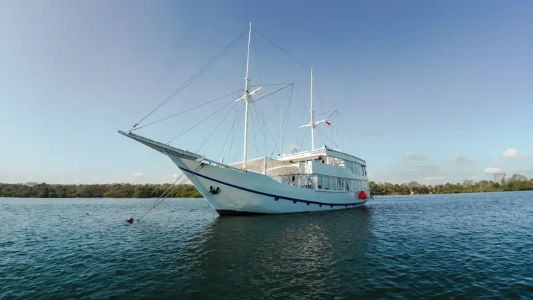 Mosalaki, a 28-metre ironwood phinisi, sailing in Komodo National Park
