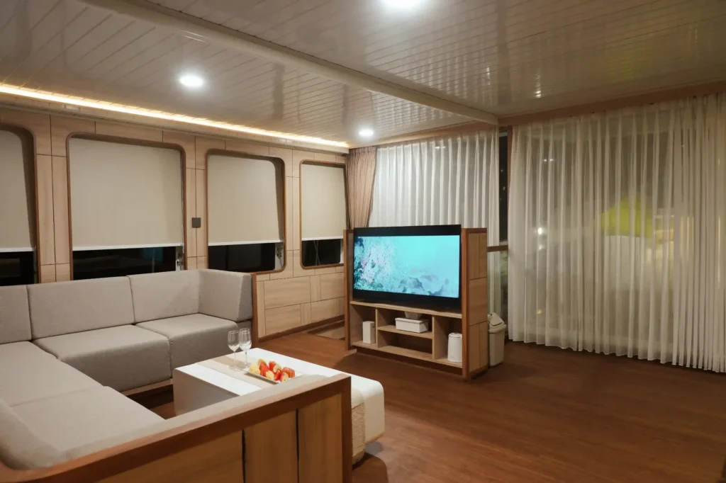 Indoor lounge on Mosalaki with seating and the onboard audio system