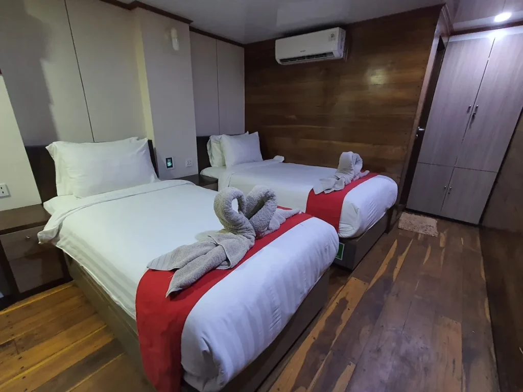 Twin beds in a Deluxe Cabin aboard Sea Familia 2