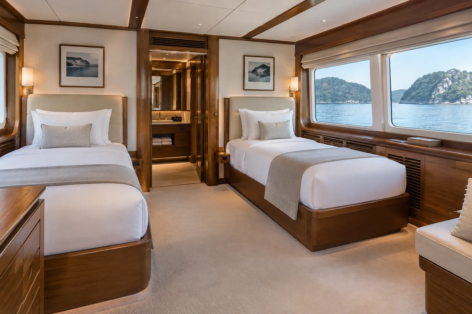Two separate beds with white linen and a clear aisle in a yacht cabin.