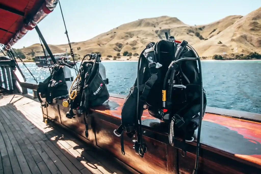 Scuba equipment prepared on the dive deck of Manta Mae
