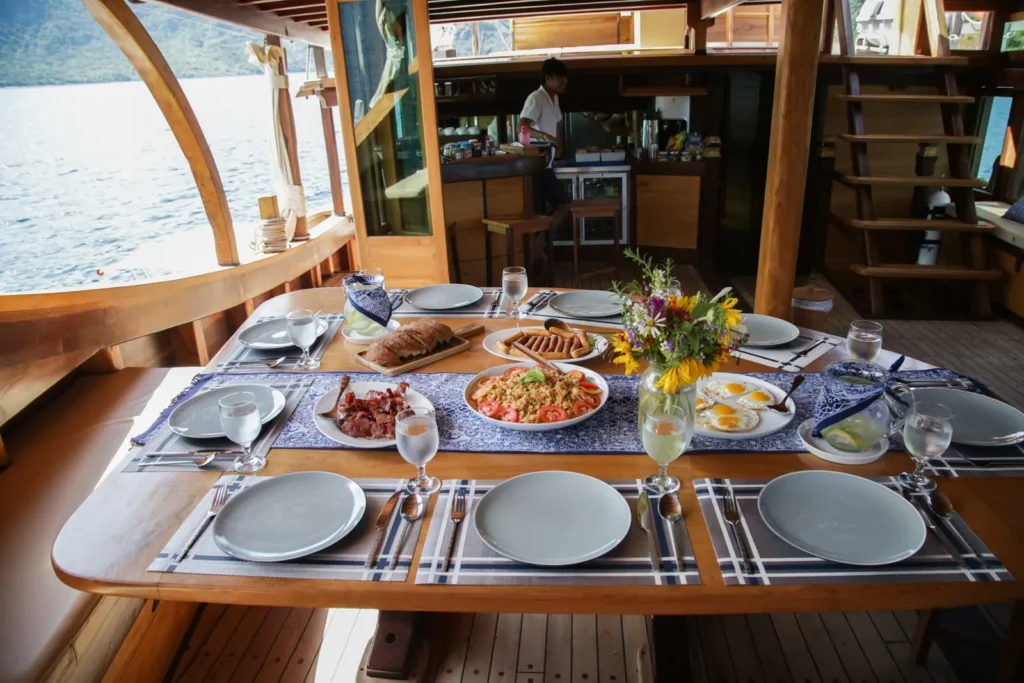 Outdoor dining table prepared aboard Tanaka Phinisi